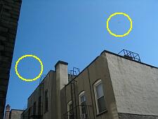 the two dots in the yellow circles are helicopters hovering over our building looking toward the williamsburg bridge