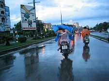 fighting the rain with a poncho in high heels